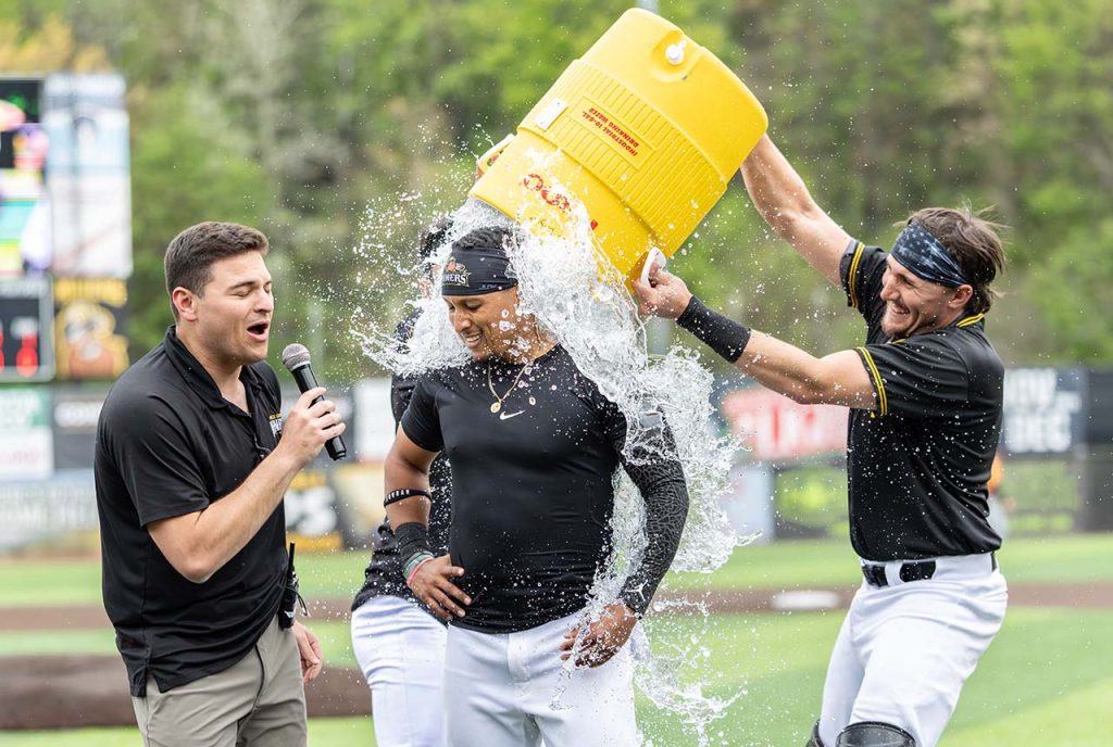Keenan O’Brien dunks Edwin Mateo, who hit the game-winning RBI single (photo by Phil Hoops)
