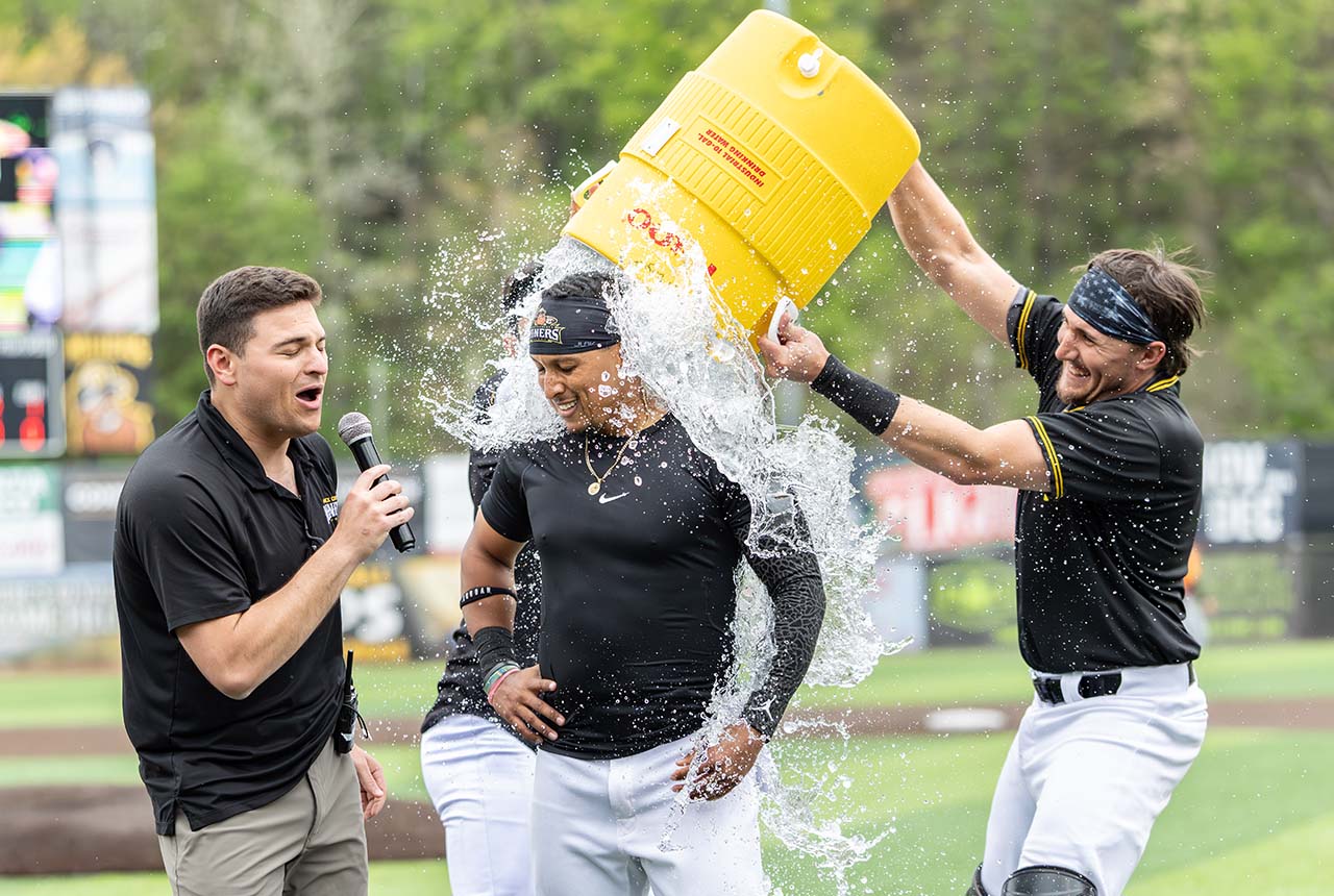Keenan O’Brien dunks Edwin Mateo, who hit the game-winning RBI single (photo by Phil Hoops)