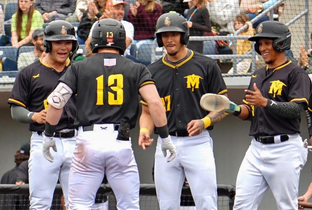 Will Zimmerman’s teammates await to congratulate him after his grand slam. Photo by Logan Winslow.
