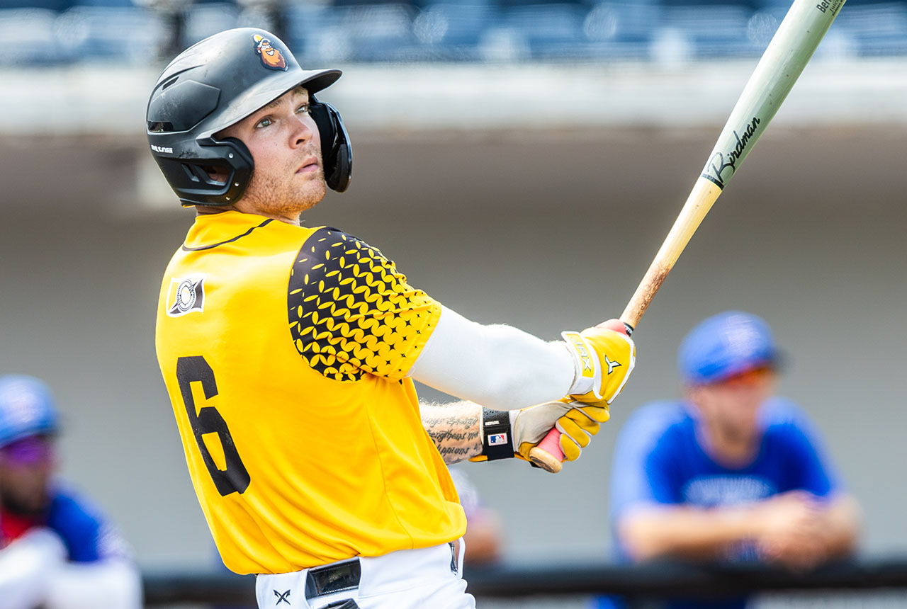 Sussex County Miners shortstop Evan Berkey hits in the gold jersey (photo by Phil Hoops).